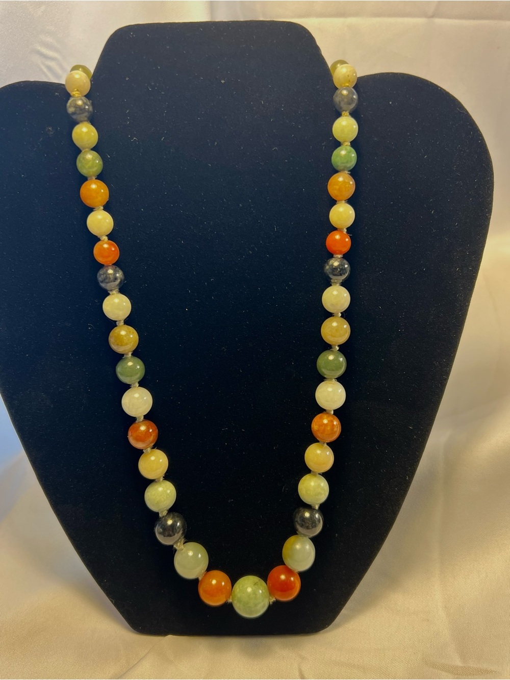 Vintage Multicolor jadeite graduated round beads Necklace with 14k g closures.